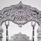 Elegant silver-coated Bal Gopal Jhula enhancing pooja room décor
