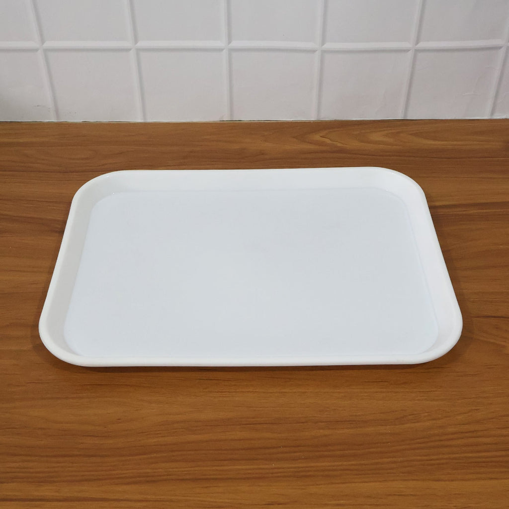 Angled photo of simple functional white plastic serving tray