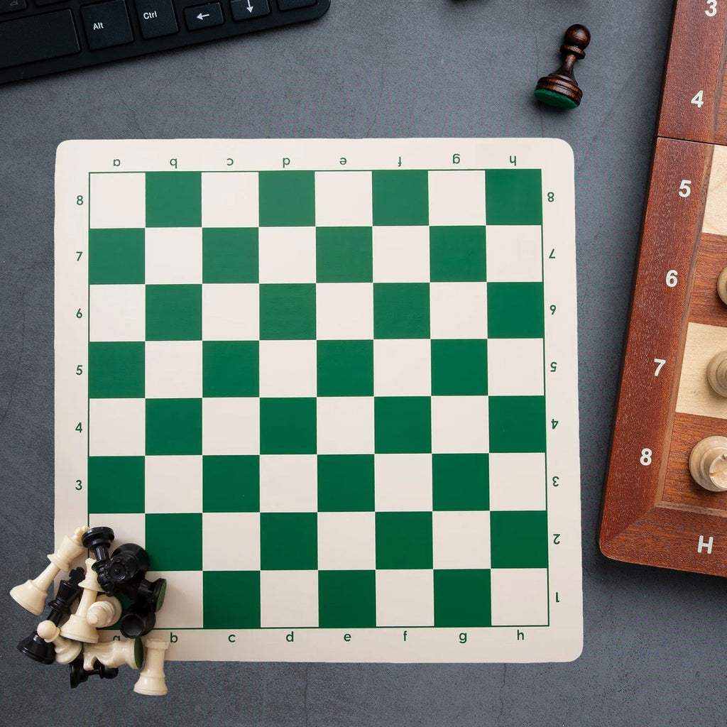 Close-up of plastic chess pieces on foldable portable chessboard