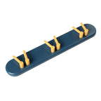 Versatile toothbrush holder with a no-drill wall mount and multiple hooks.