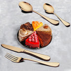 Full 24-piece gold flatware set with forks, spoons, and knives in its gift box.