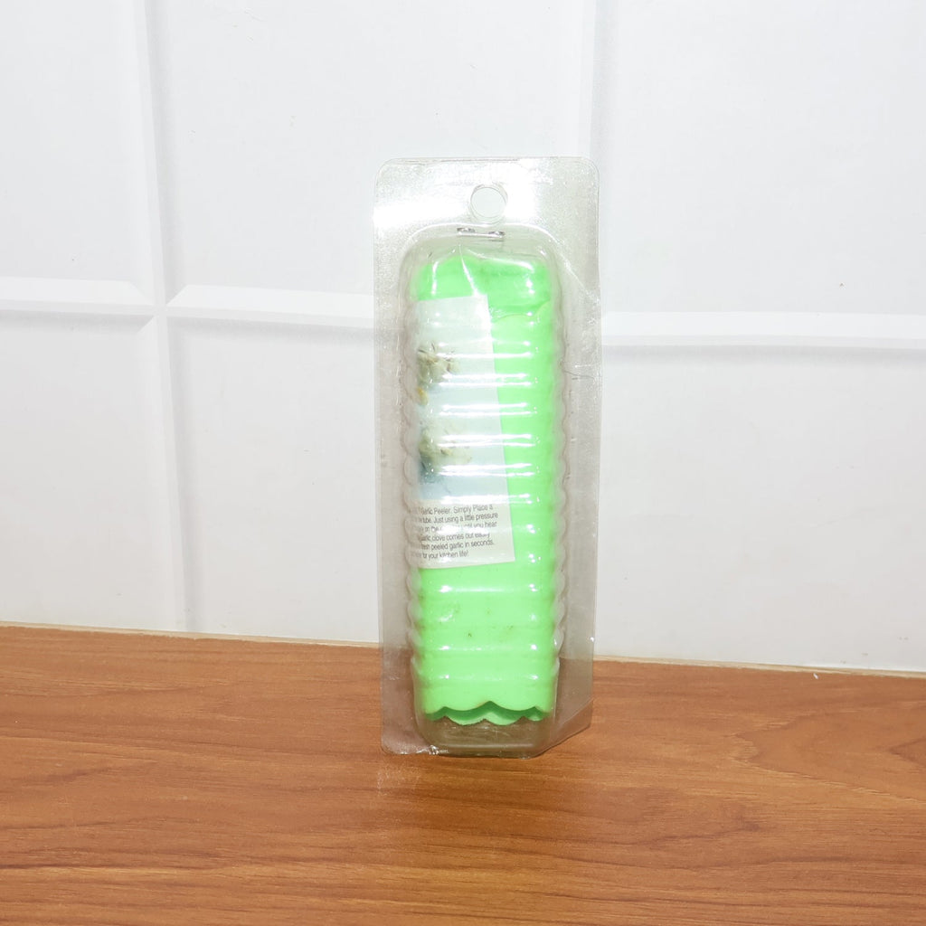 Compact silicone garlic peeler tube stored in kitchen drawer