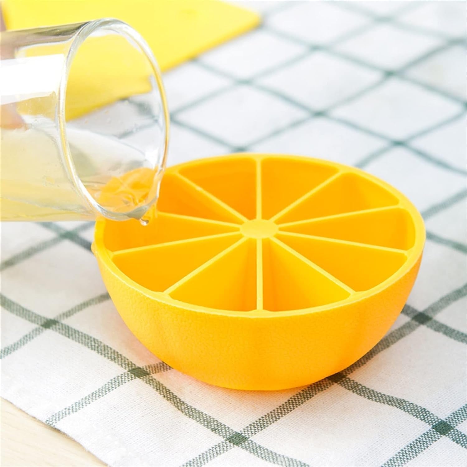 ChillPour bright green flexible lemon-shaped silicone ice cube tray in kitchen