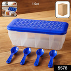 Clear 4-section container filled with various Indian spices and dry fruits.