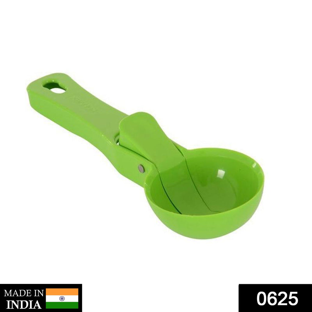 Durable green plastic ice cream scoop ready for serving.