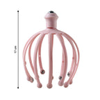 Side view of the manual scalp massager, highlighting its compact design.