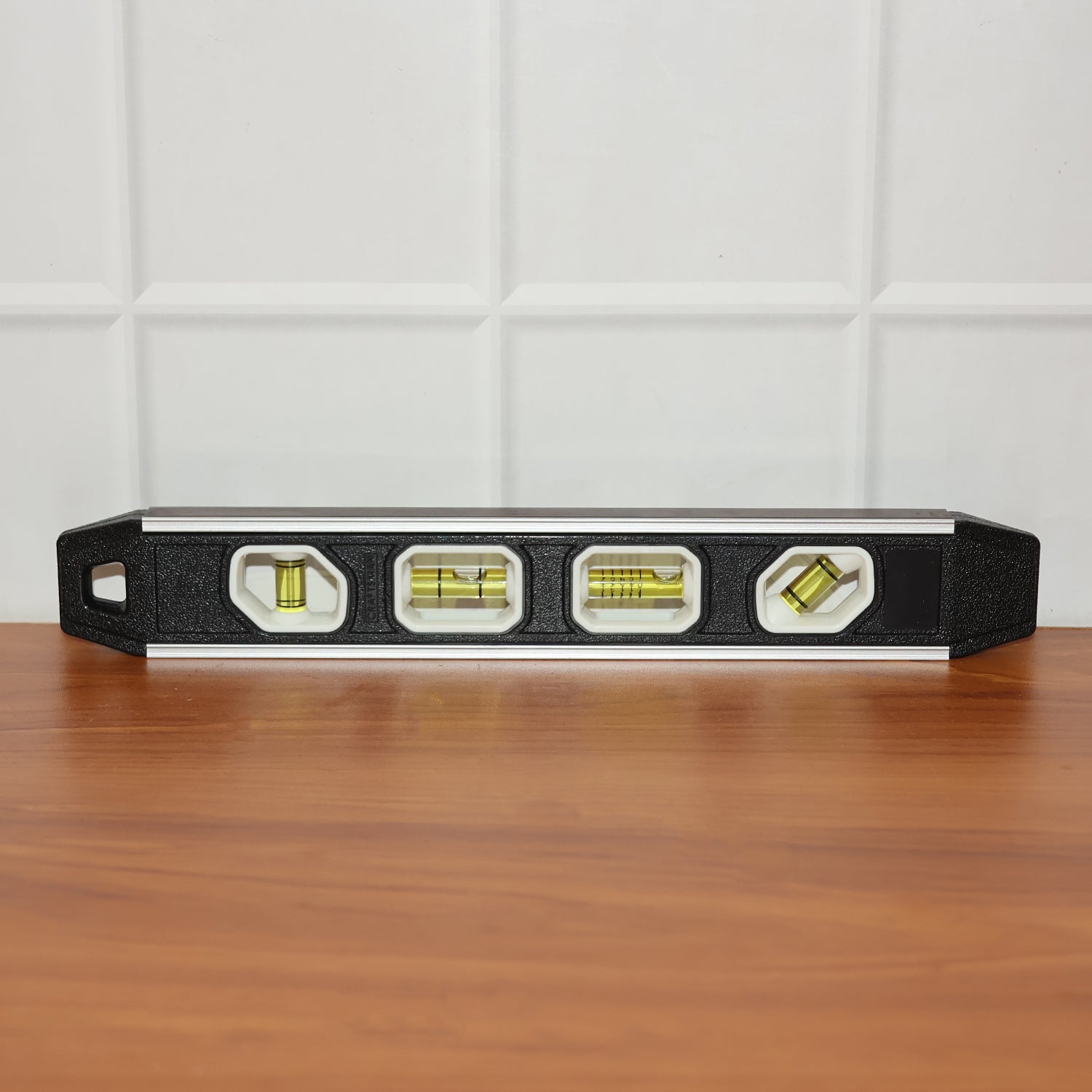 Precision aluminum spirit level with clear markings on bubble vials for alignment