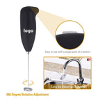 Close-up of the battery-operated hand blender's stainless steel whisk head.