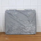 Close-up of the durable double zipper and reinforced handle on the foldable storage bag.