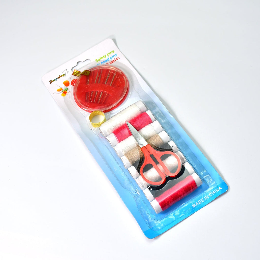 Organized sewing kit with thread, needles, and measurement tape for home use.