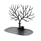Jewellery display stand with deer antler design holding earrings