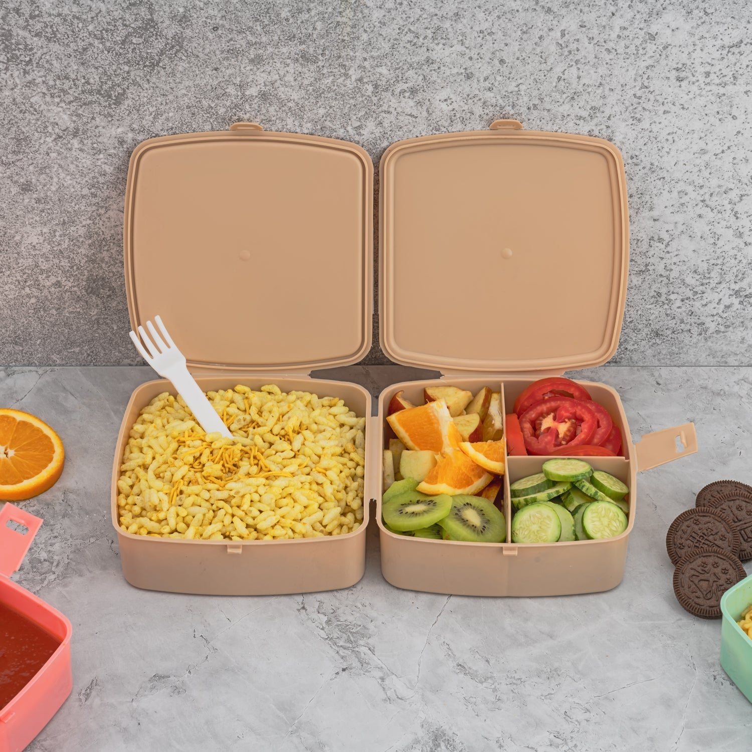 Blue 4-compartment tiffin box with spoon, ideal for school or office use.