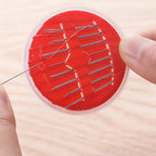 Essential stitching kit components like needles and thread organized