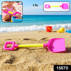 Child holding kids beach sand shovel digging sand at the beach
