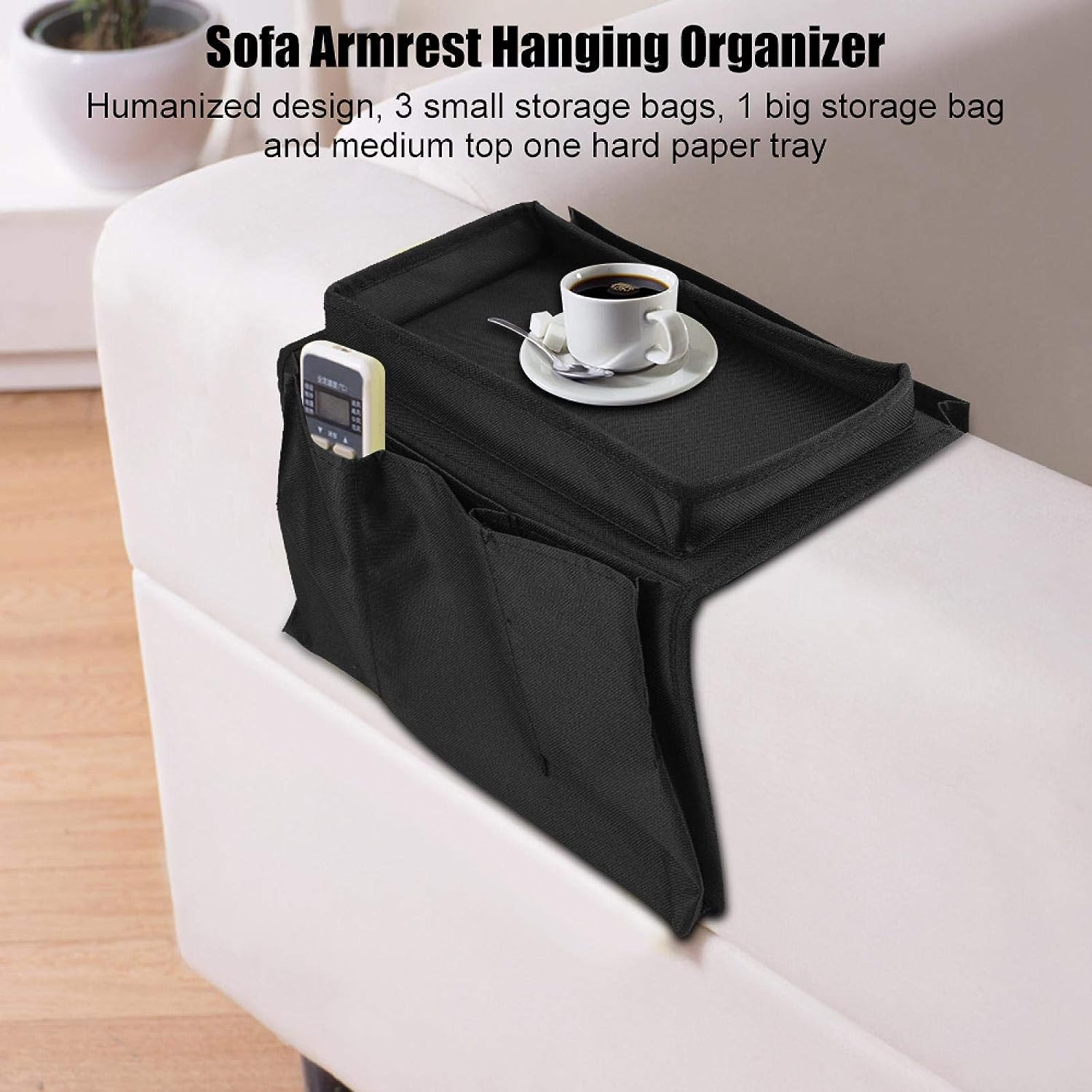 View of the multi-pocket sofa armrest organizer hanging on a grey sofa.