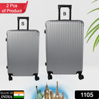Two hard case trolley bags, big and small, in striking multi-colors, ready for travel.