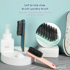 The compact cleaning brush held comfortably, demonstrating its ergonomic handle.