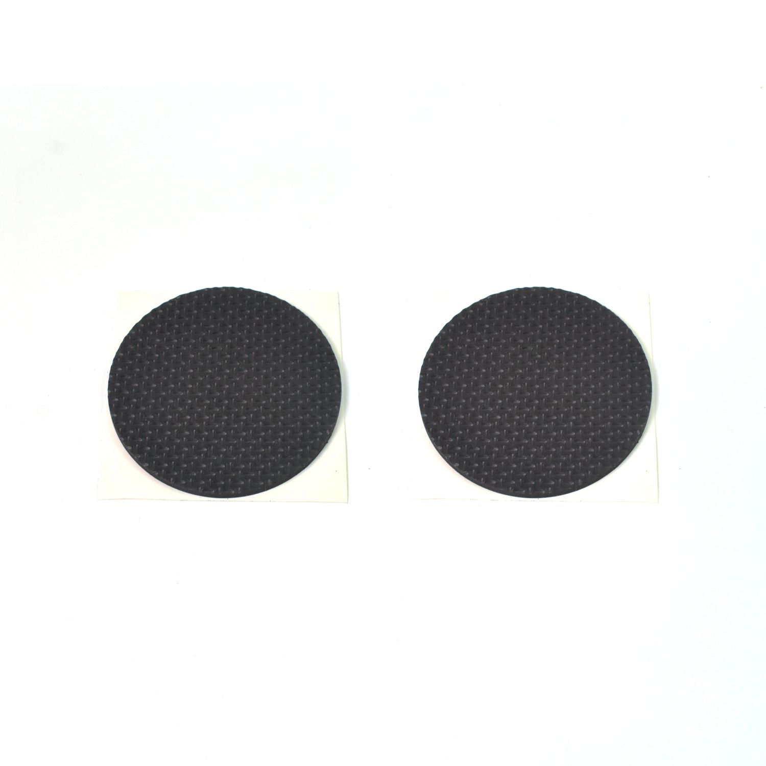Various sizes of brown felt furniture pads laid out for floor scratch prevention.
