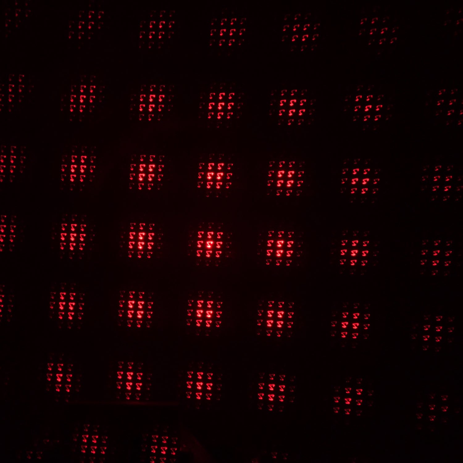 A galaxy projector creating a romantic starry night effect in a dimly lit room.