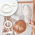 Multi-purpose Closet Organizer Hanger for neatly storing hats, scarves, and bags.