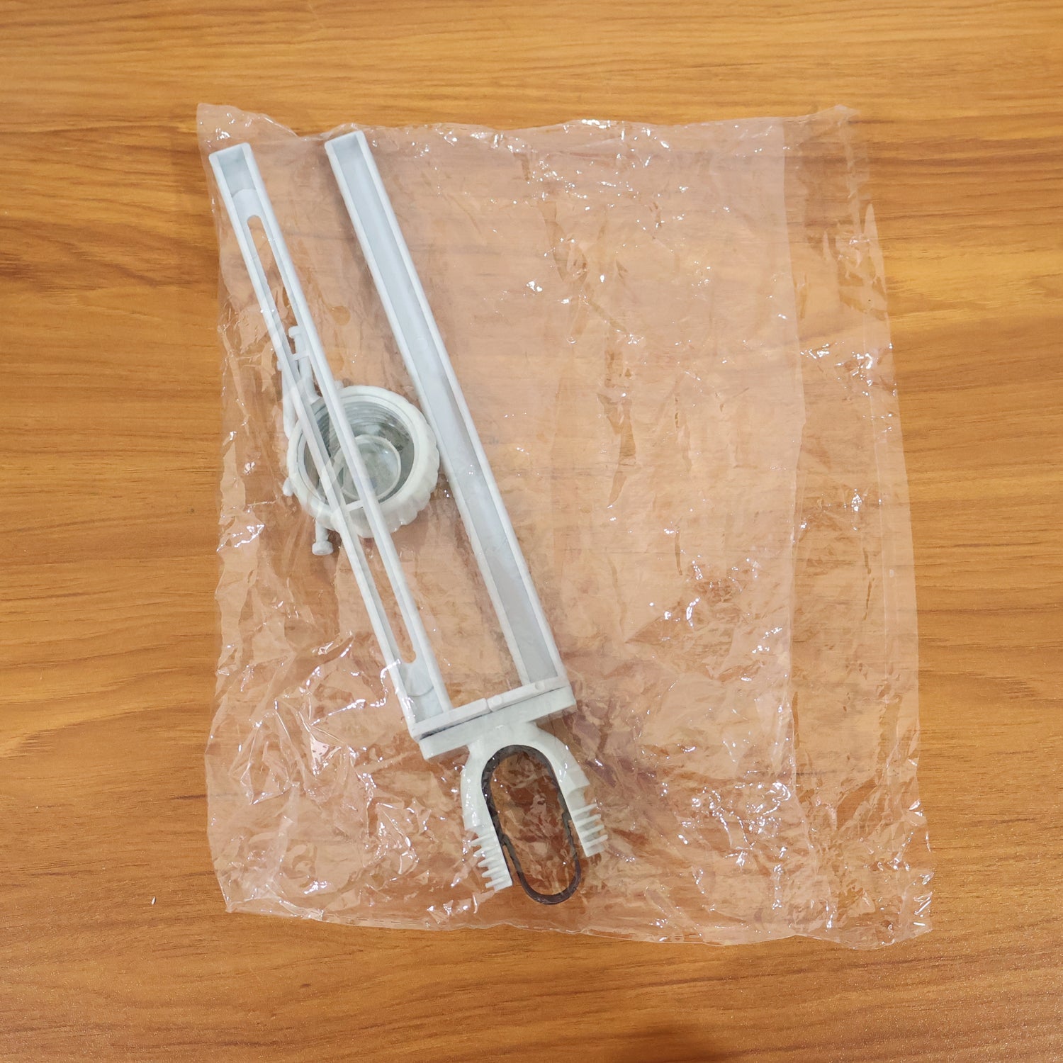 Multipurpose organizer hanging from kitchen sink faucet