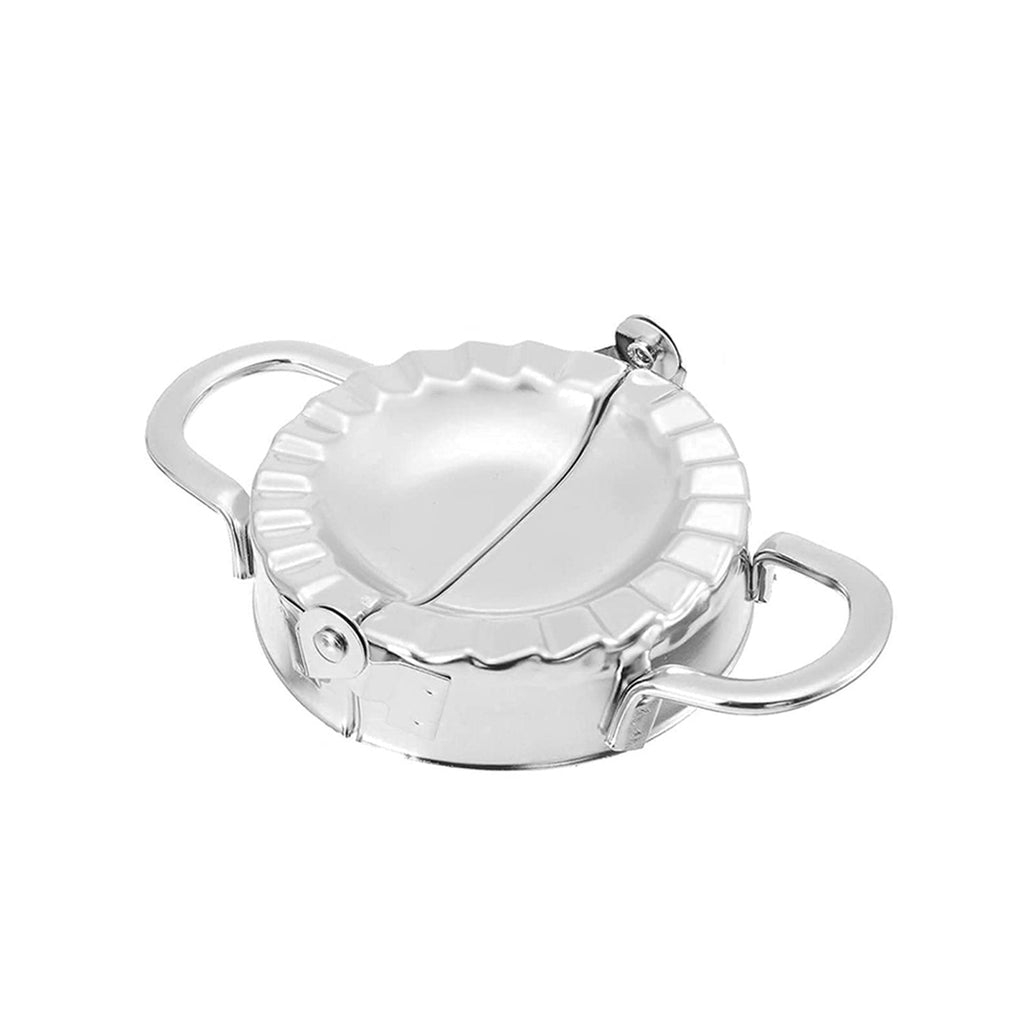 Set of stainless steel dumpling maker and accompanying dough cutter.