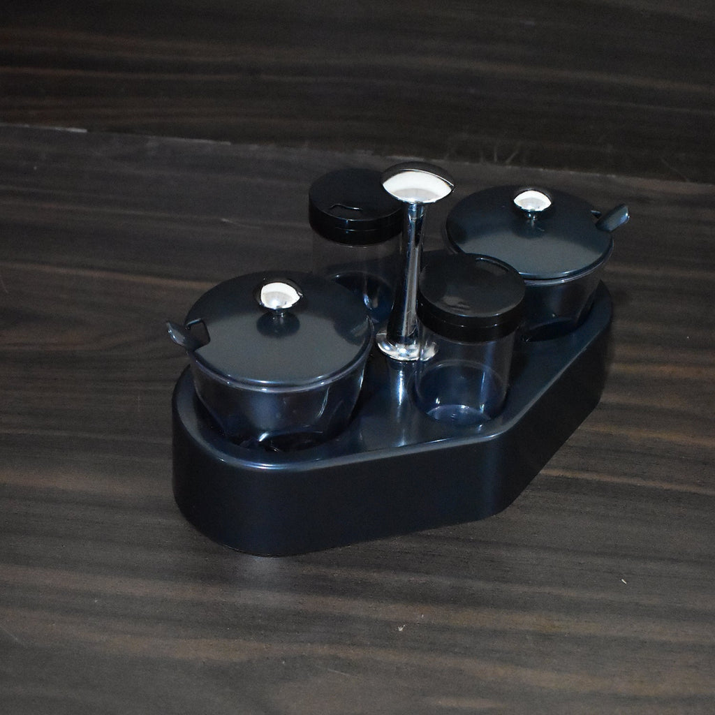 Transparent plastic jar from the Ganesh Spice Condiment Set, ideal for viewing contents.