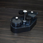 Transparent plastic jar from the Ganesh Spice Condiment Set, ideal for viewing contents.