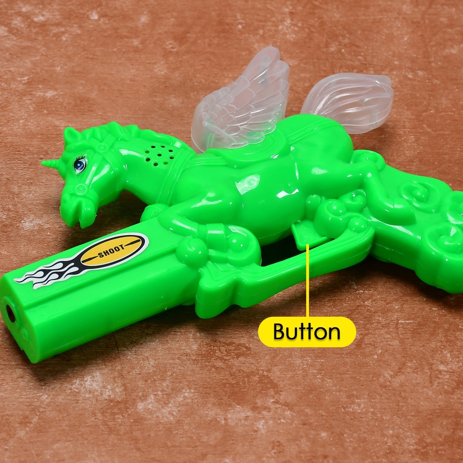 Action shot of the laser light toy gun illuminating with colorful lights.