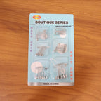 Organized set of rust-resistant metal safety pins in various sizes