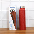 Red stainless steel water bottle in natural light highlighting design