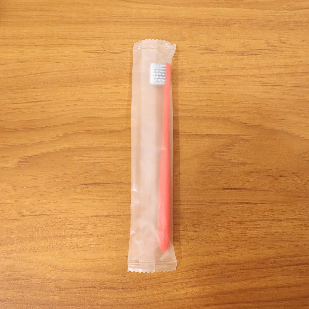 Child-friendly soft bristle toothbrush with ergonomic handle