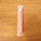 Child-friendly soft bristle toothbrush with ergonomic handle