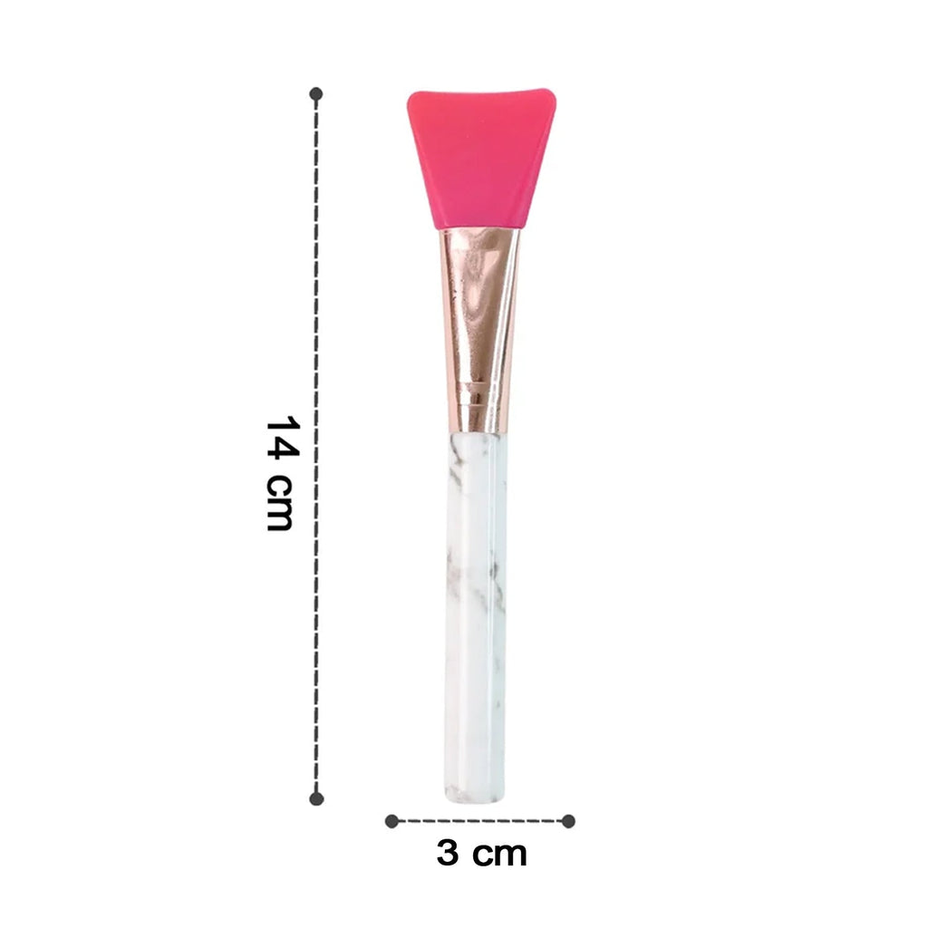 Silicone face mask brush angled view showing head and handle