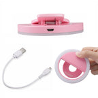 Selfie ring light mounted on a mini tripod stand, ideal for videos and streaming.