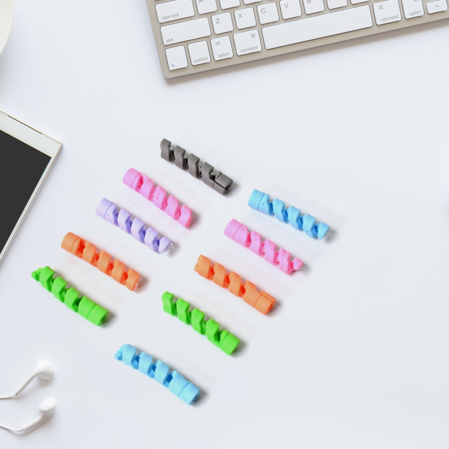 Flexible cable protector wrapped around a white earphone cable.