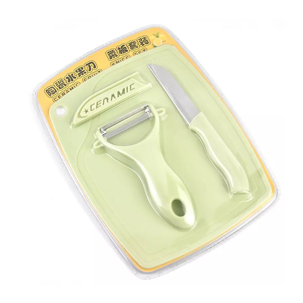 Comfortable ergonomic handles on the kitchen knives and green peeler for easy grip.