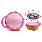 A baby playing with the colorful Flash Drum Toy, enjoying its lights and sounds.