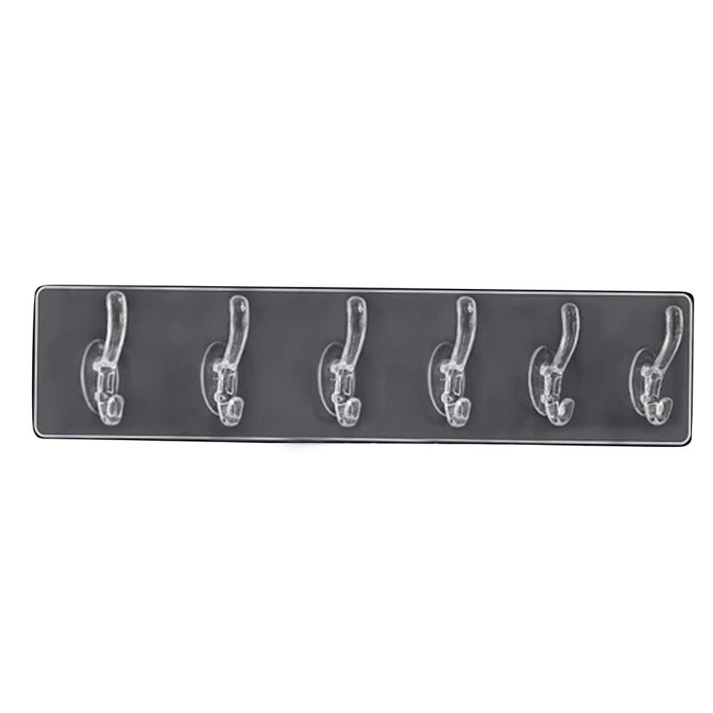 Stylish hooks rail placed in a bedroom, neatly organizing clothes and accessories.