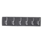 Stylish hooks rail placed in a bedroom, neatly organizing clothes and accessories.