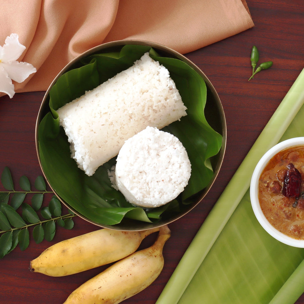 Puttu Maker with its tubular design and secure lid, ready for use.