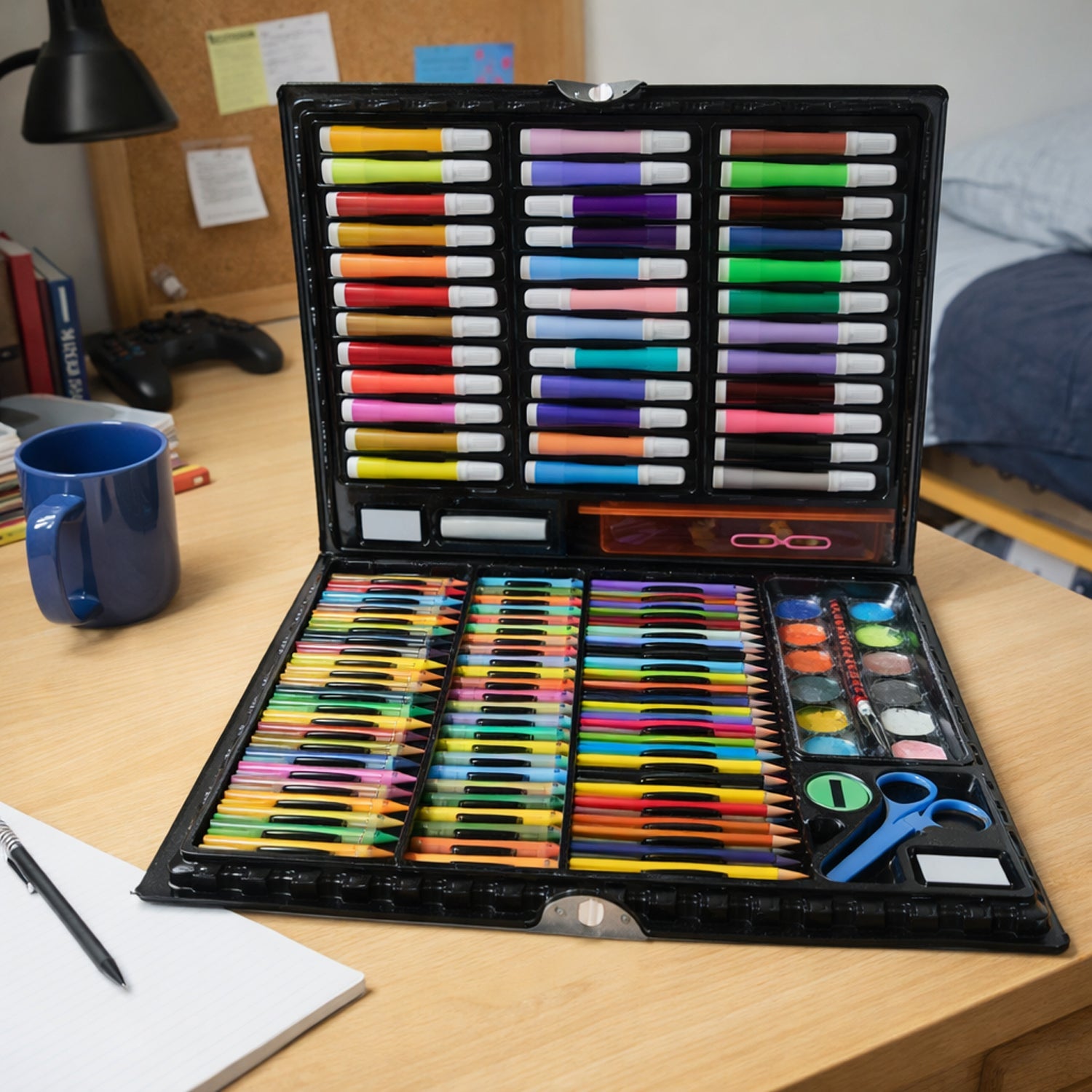 Watercolor paints and accessories included in the complete coloring art kit