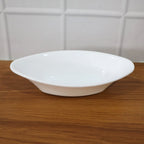White Marin oval serving bowl measured with tape showing dimensions