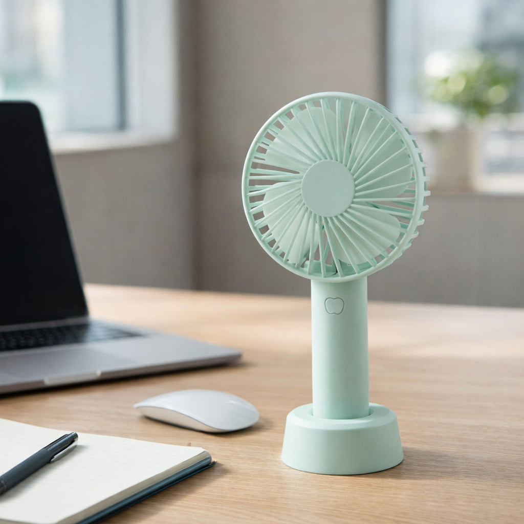 Detail of the portable fan's on/off button and sleek design elements for simple operation.