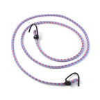 Secure bungee cord strap fastening a suitcase to a motorcycle for safe transport.
