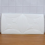 Textured white floral 3D foam wallpaper panel enhancing home interior aesthetics