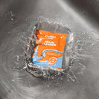 Drain cleaner sachet ready for pouring into kitchen sink drain