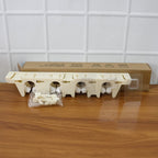 Various cleaning tools hanging on self-adhesive broom and mop holder