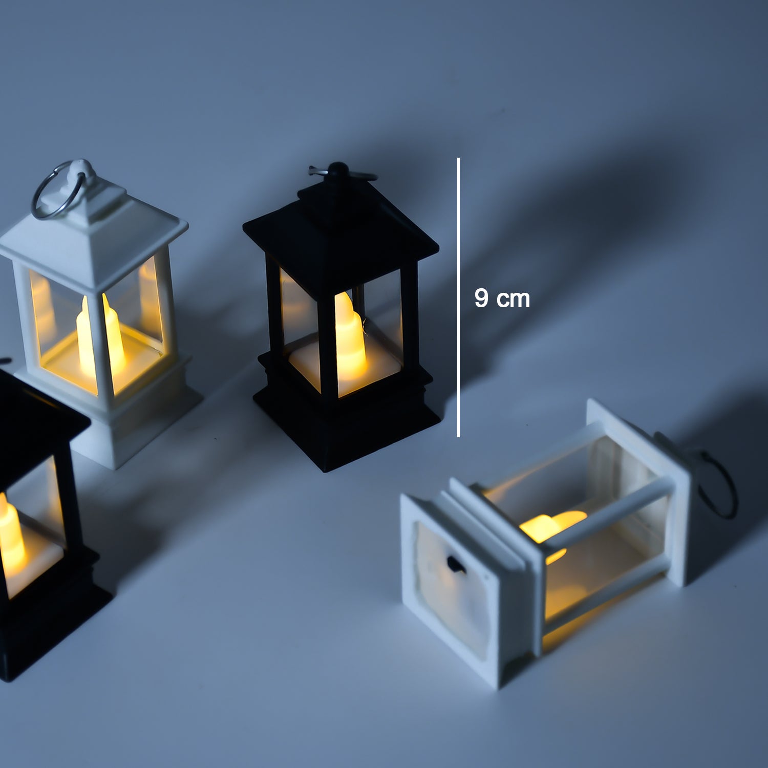 Group of flameless candle lanterns arranged for home decoration.