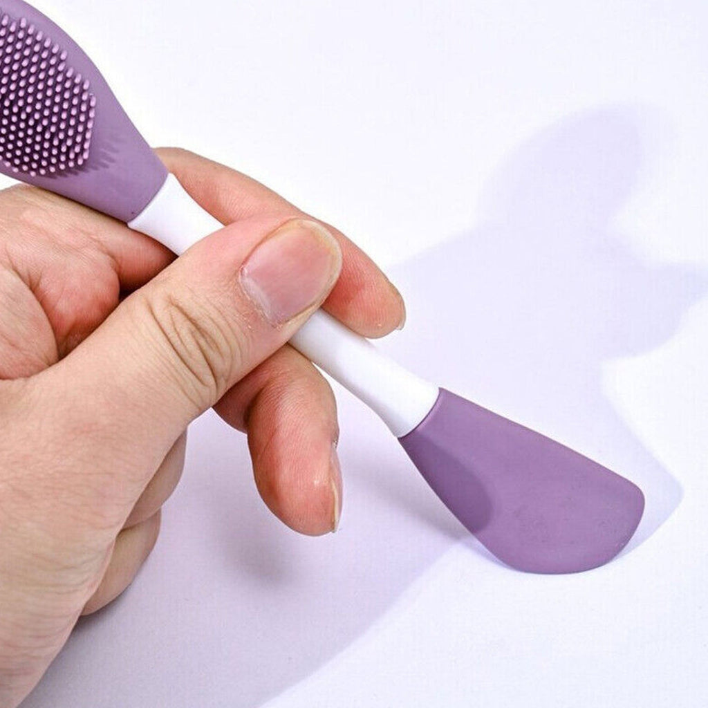 Ergonomic design of the double-headed silicone brush held comfortably for skincare application.
